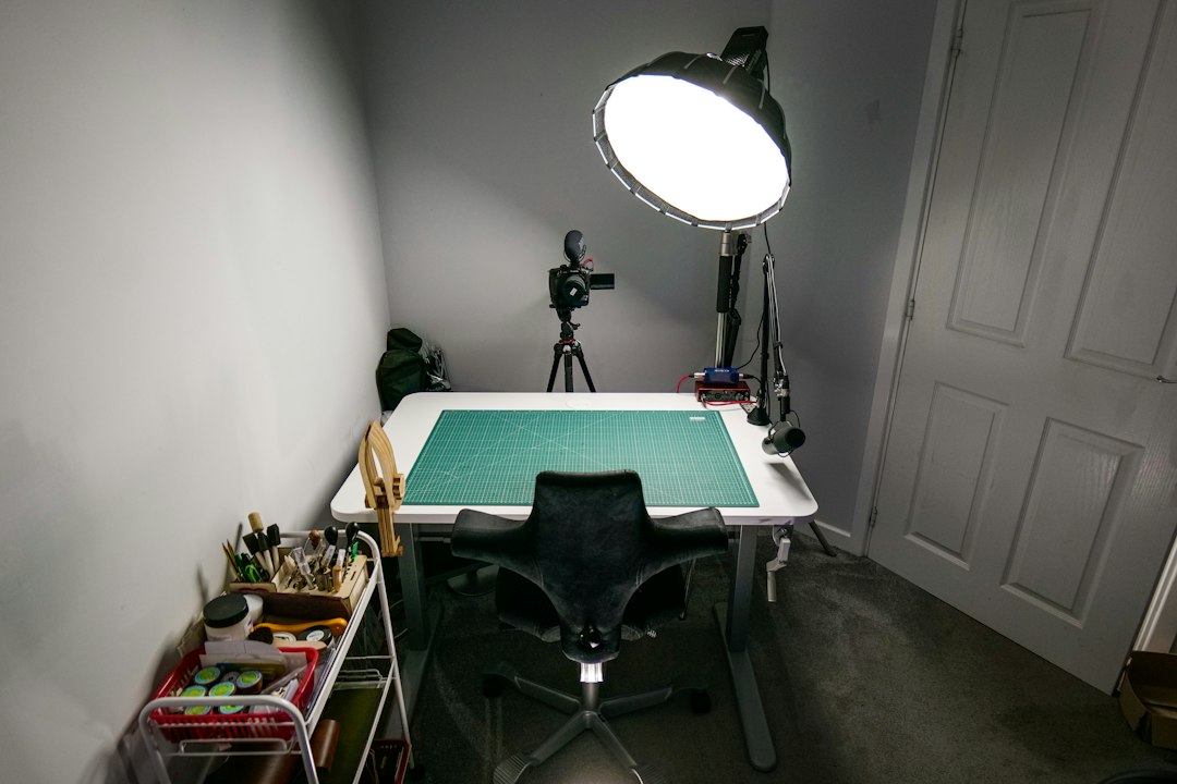 Professional photography studio interior with lighting equipment and organized creative workspace