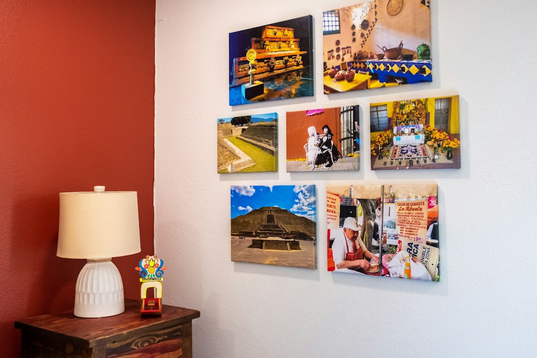 Gallery display of color photograph prints mounted and framed for exhibition showing quality printing and mounting