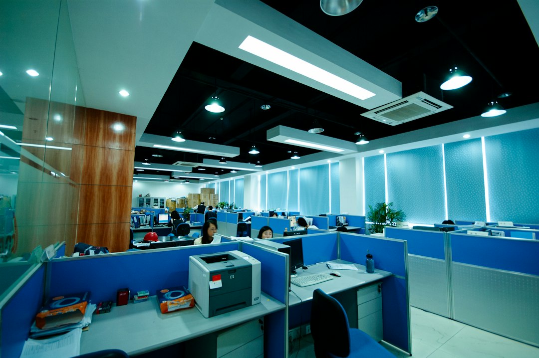 Modern office workspace with professional printer and copier equipment in contemporary document services environment